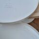 Stamped cream and white coffee table and stool, 1970s