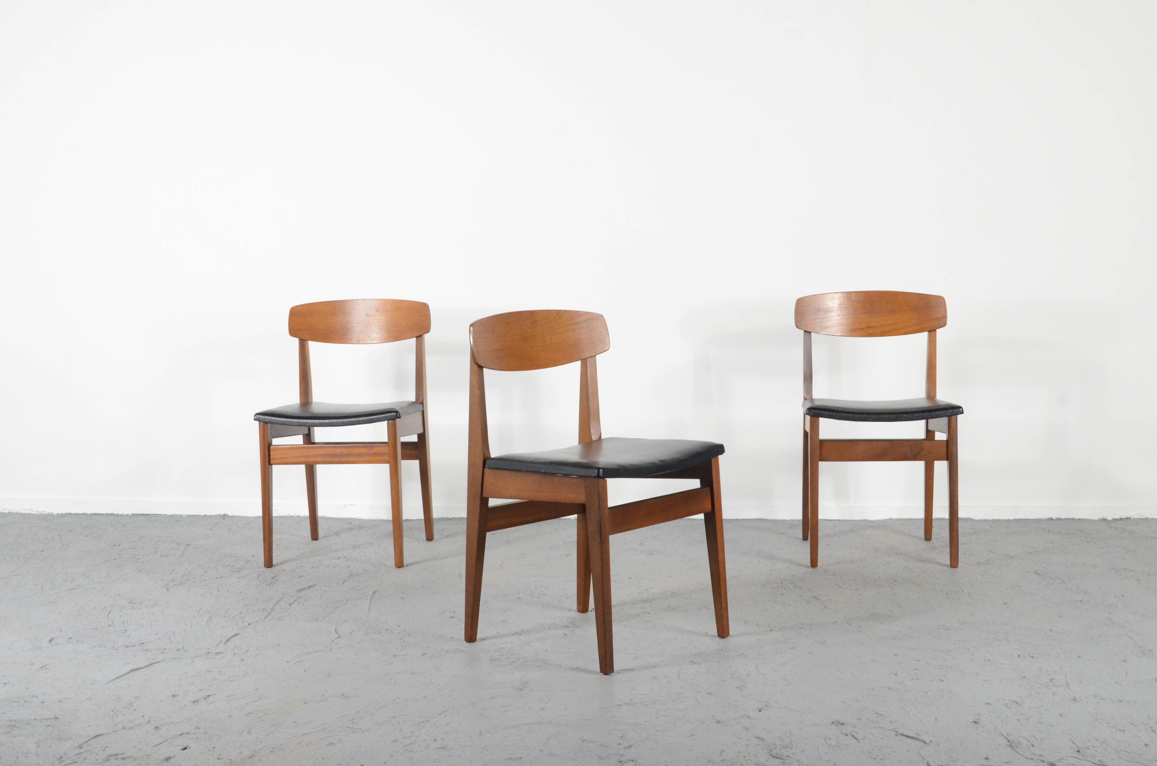Set Of 4 Midcentury Teak And Leatherette Chairs.
