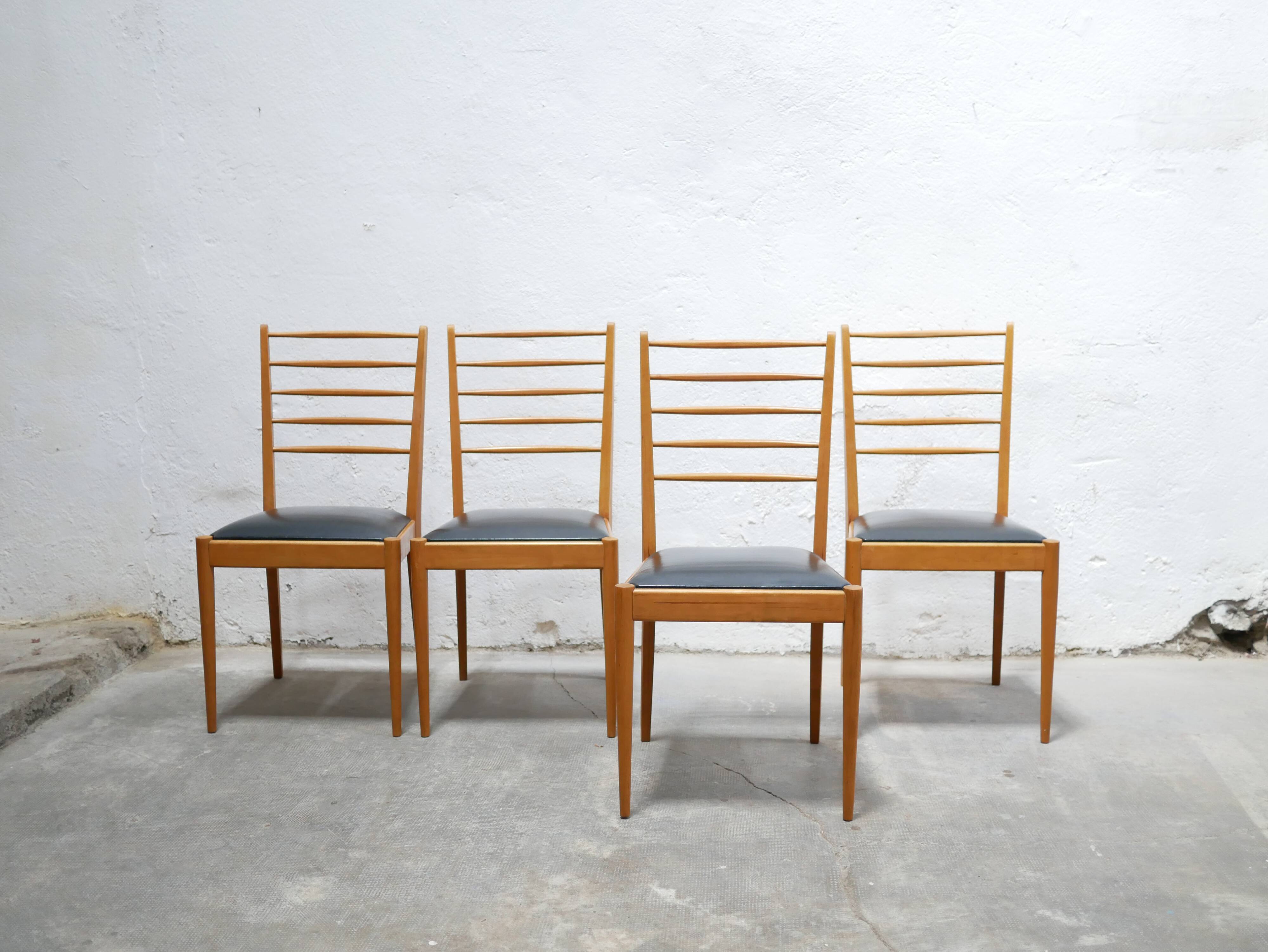 Series of 4 vintage chairs in wood and skaï