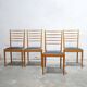 Series of 4 vintage chairs in wood and skaï