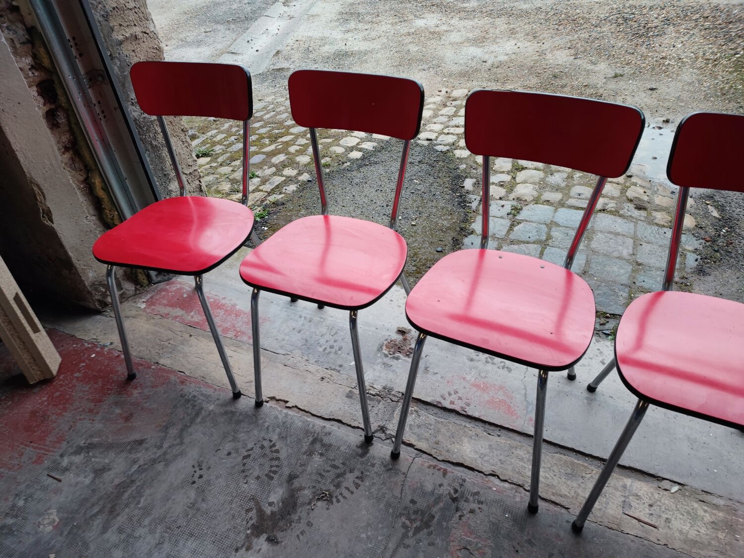 6 red and chrome Formica chairs