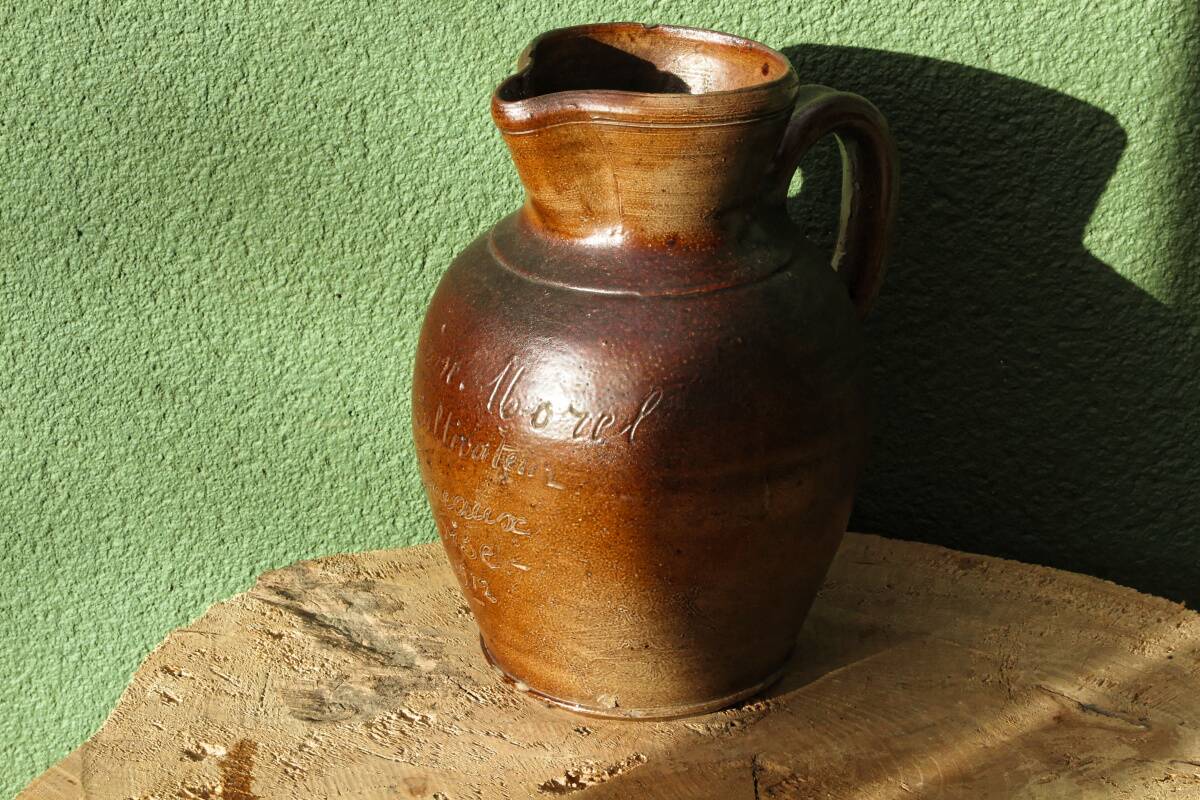 Large stoneware jug with a family name pattern, 1912