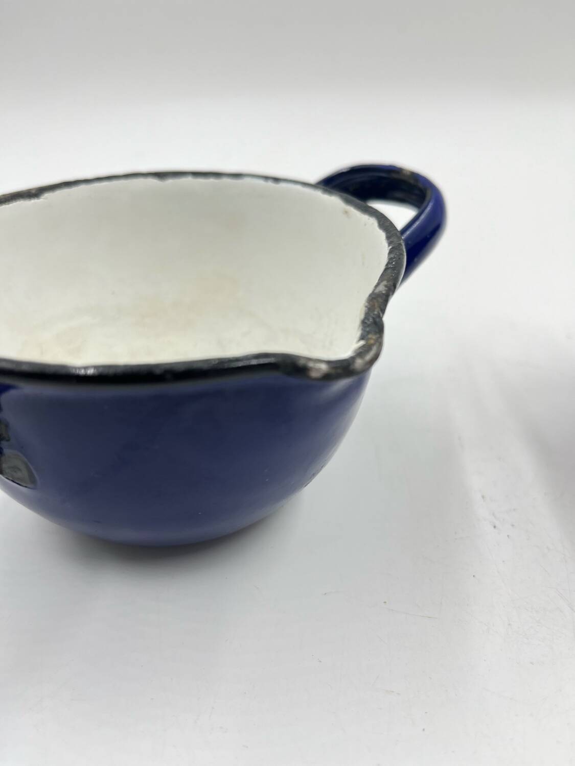 Enamelled metal fondue pot duo