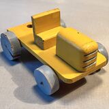 Yellow wooden tractor, antique toy