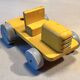 Yellow wooden tractor, antique toy