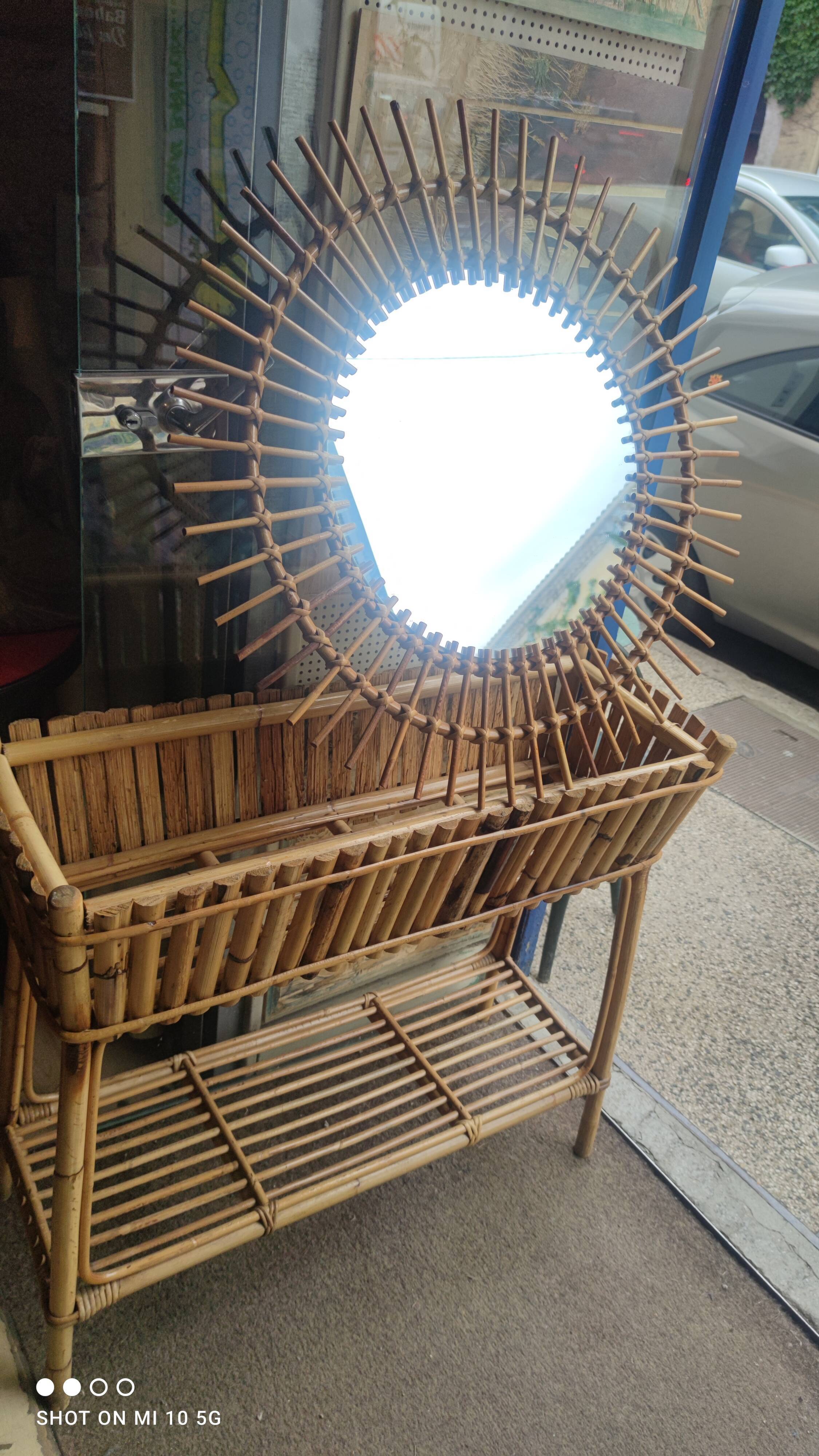 Rattan sunburst mirror, circa 1960, 72 cm in diameter
