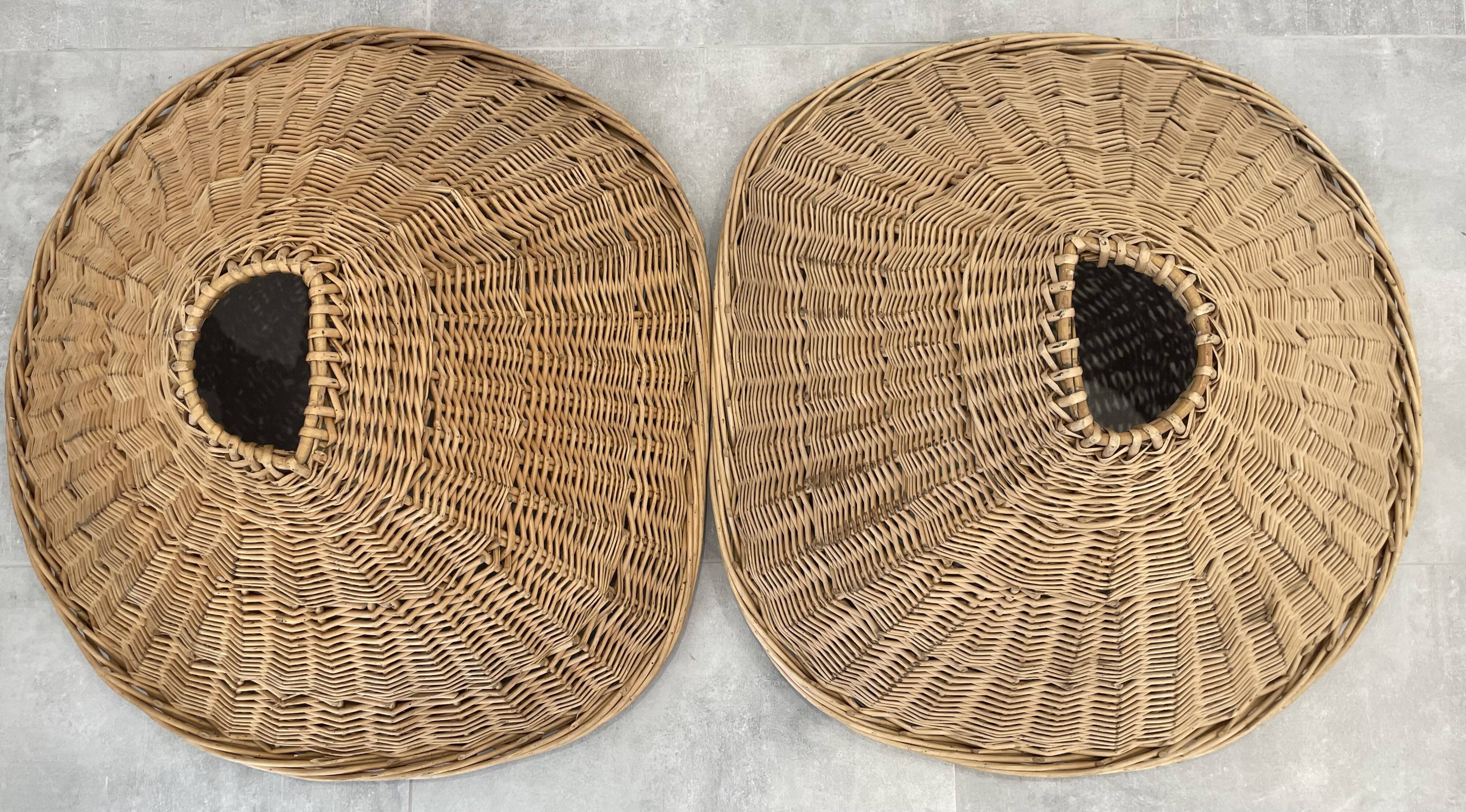 Pair of rattan and black metal armchairs, 1950s/60s