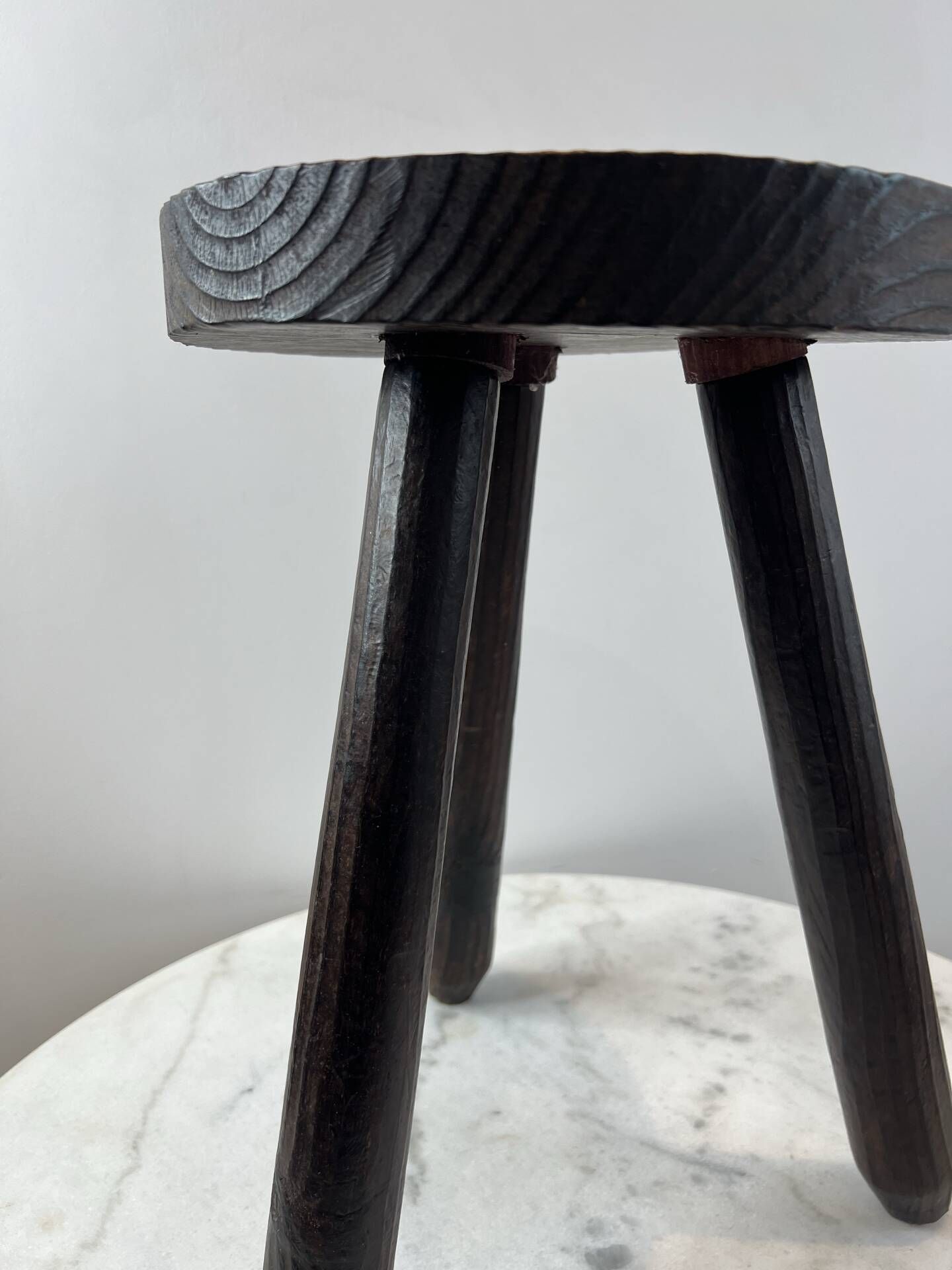 Tripod stool in turned, patinated wood
