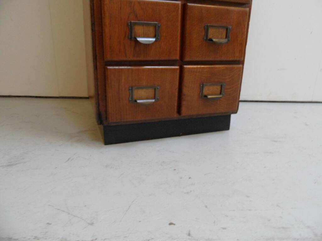 Antique oak apothecary cabinet with drawers