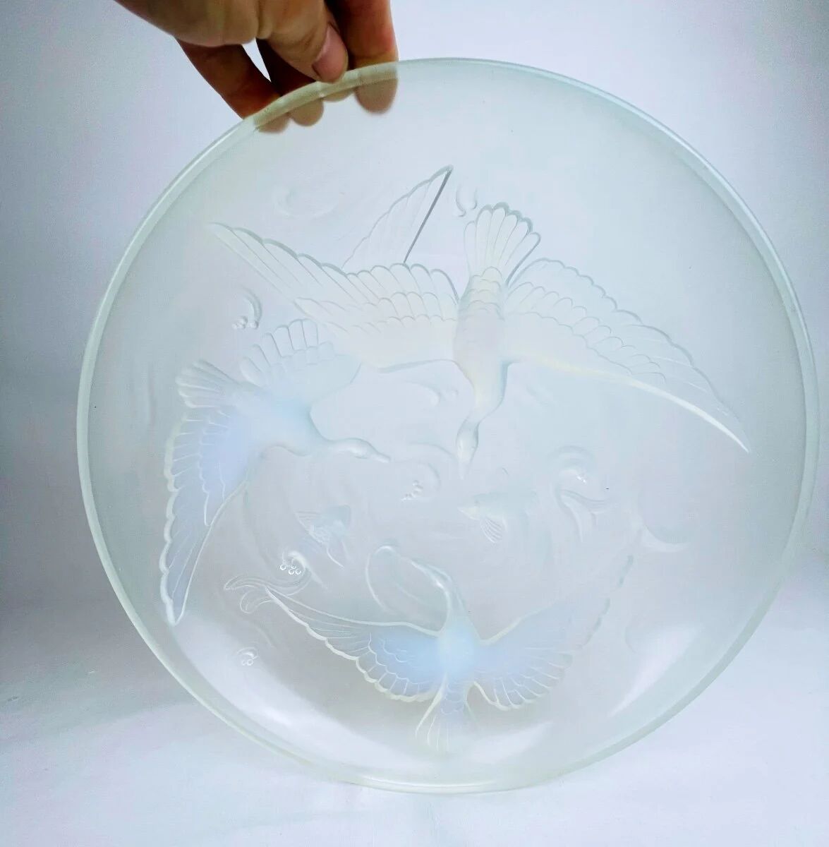 Verlys, iridescent glass cut with a design of geese and fish.