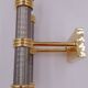 Pair of designer golden brass wall lights with gun barrel decor