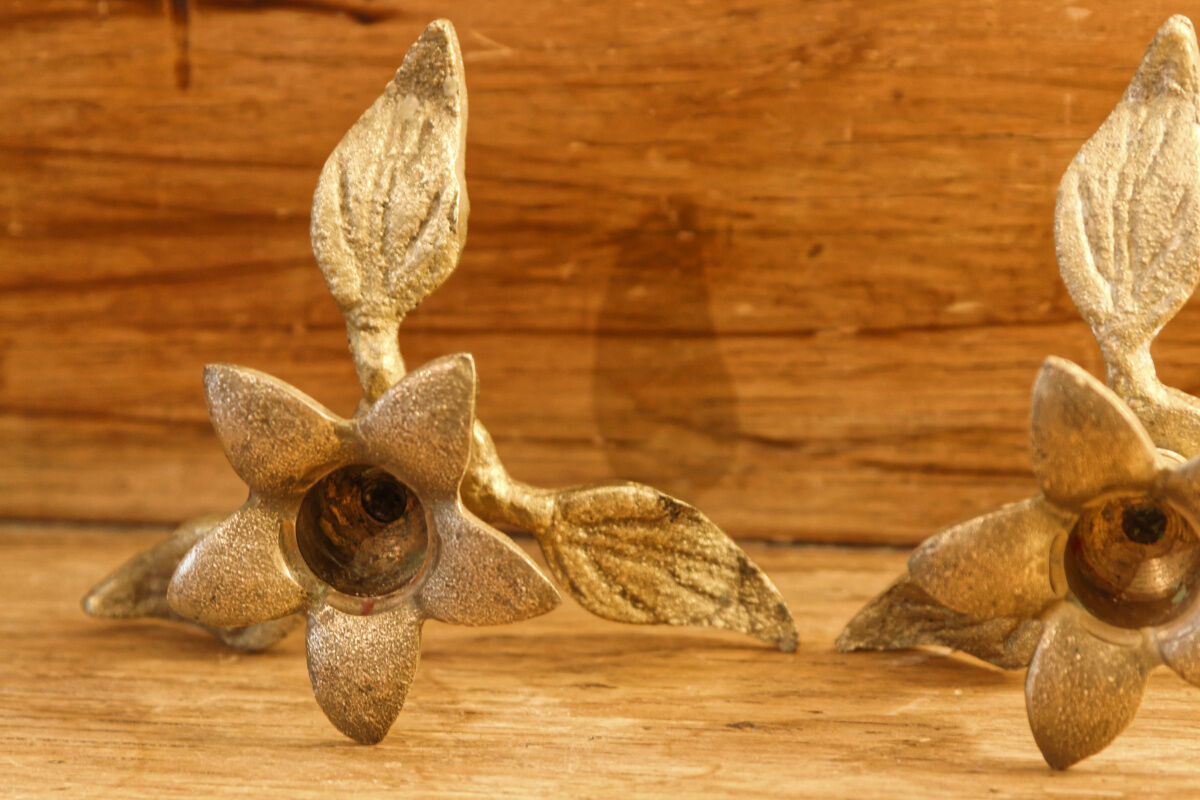 Pair of brass candle holders, flowers