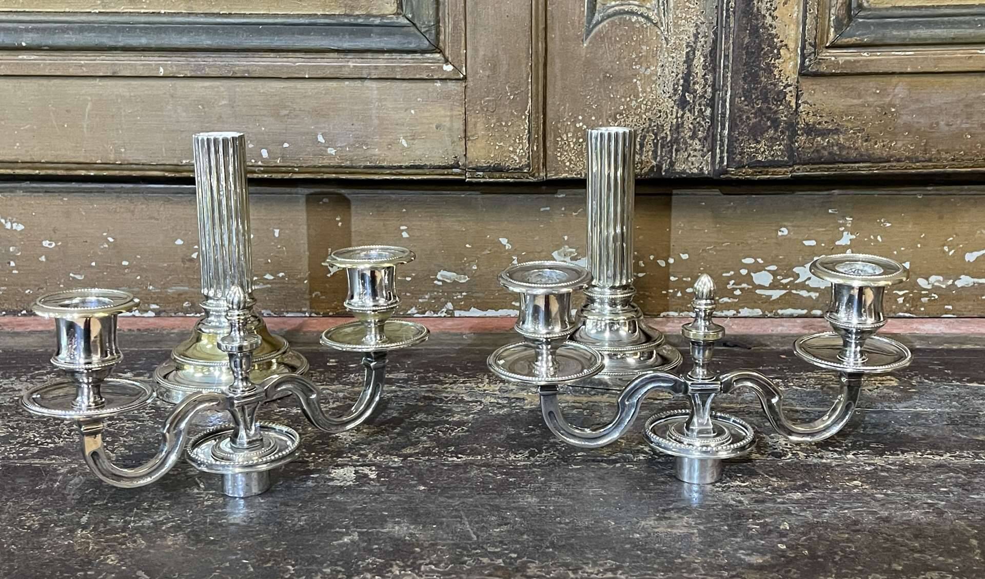 Pair of 2-branched candlesticks in silver metal