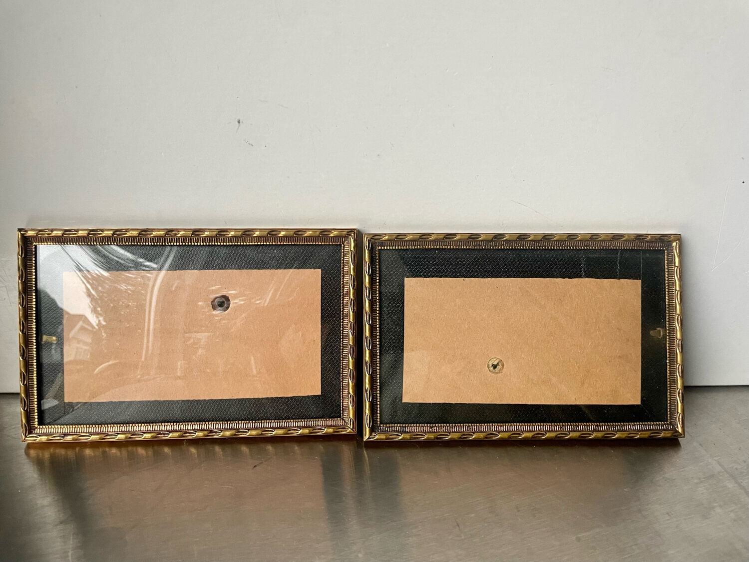 Pair of identical gold colored metal frames each measures  14.5 cm x 9 cm convex glass