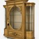 French antique Louis XVI display cabinet in gilded wood with curved glass sides.