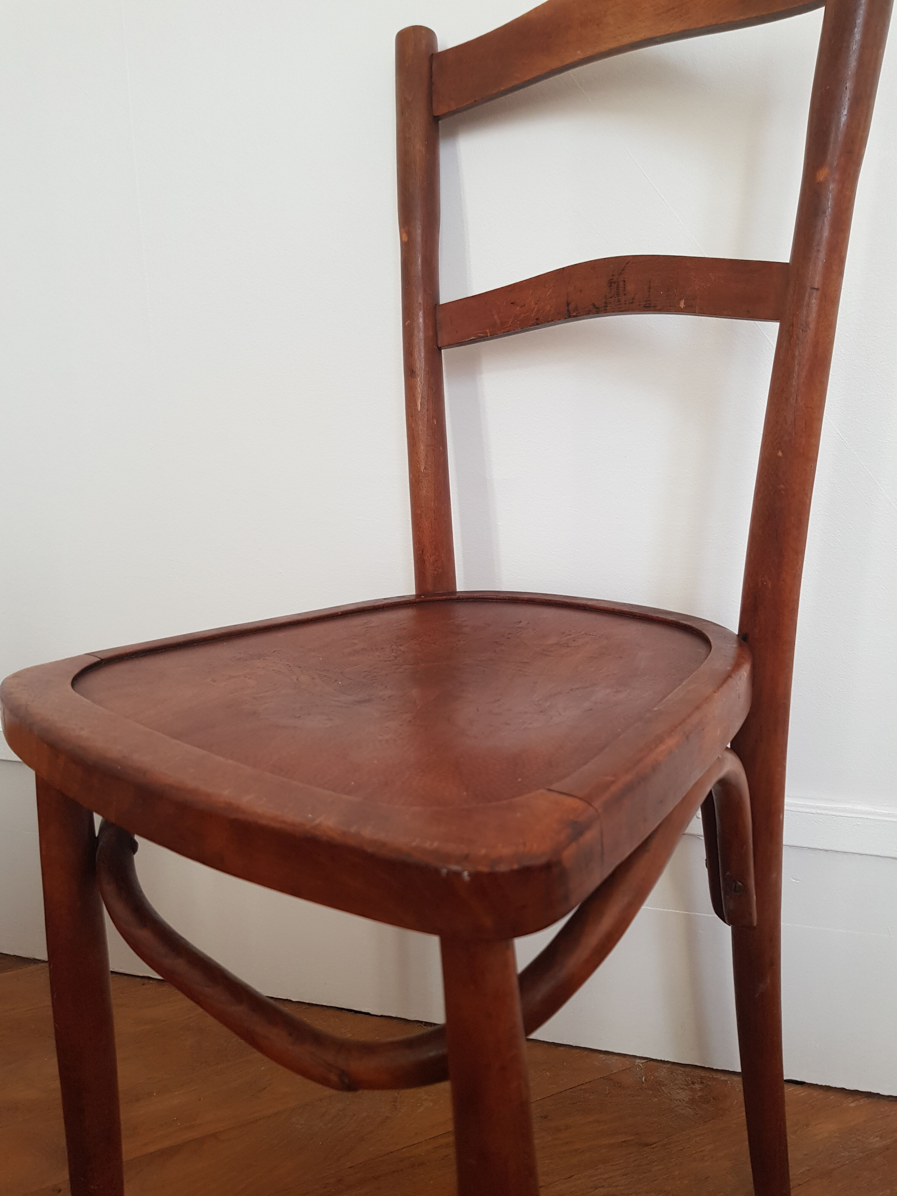 Curved wooden bistro chair