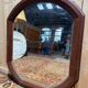 Miroir octogonal biseauté – Époque 1900 – Cadre bois teinté acajou