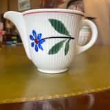 Old porcelain milk jug with barbel decoration