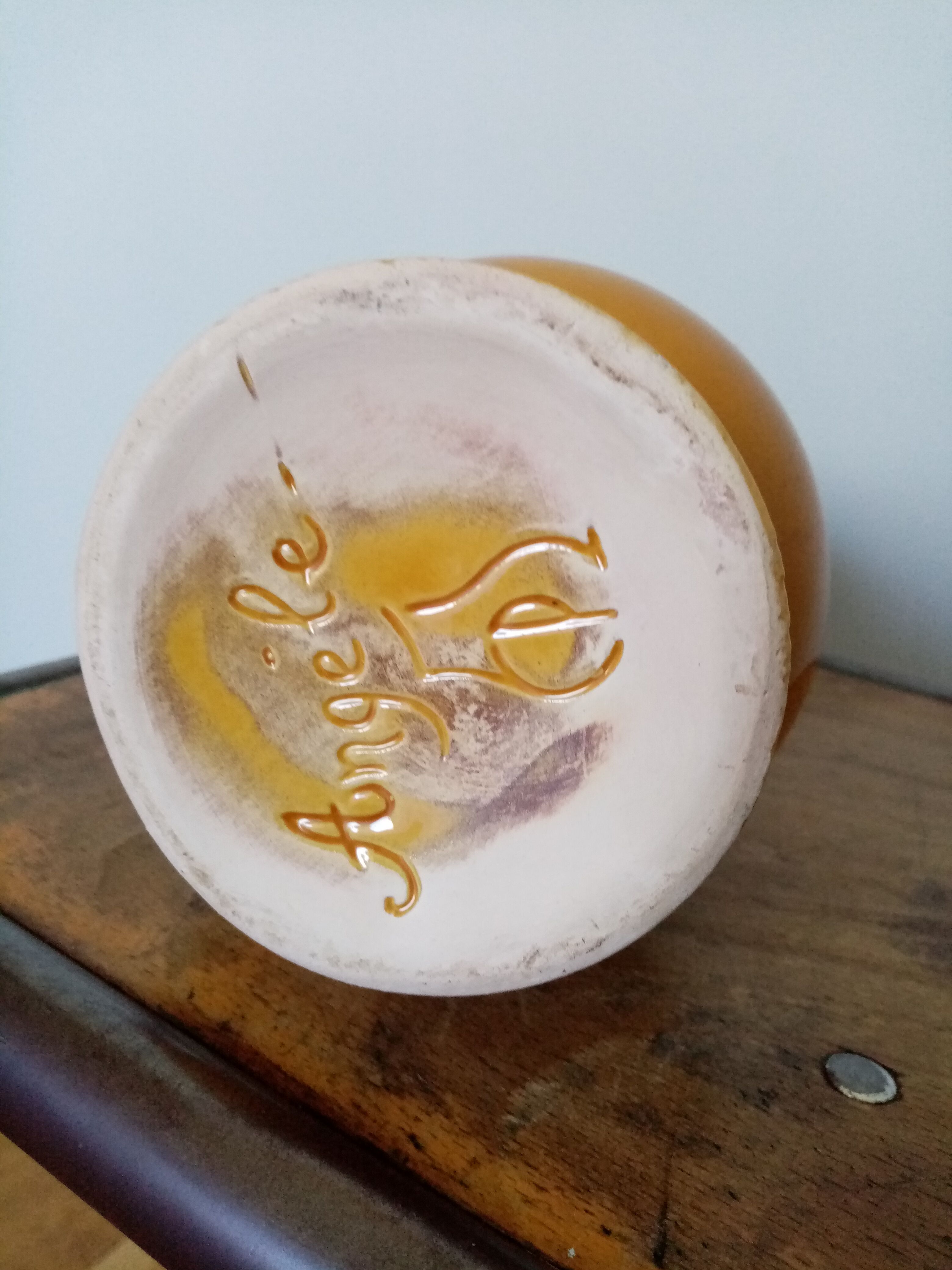 Mustard yellow enamelled ceramic pitcher