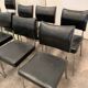 Suite of nine vintage chairs in chrome and imitation leather XX century