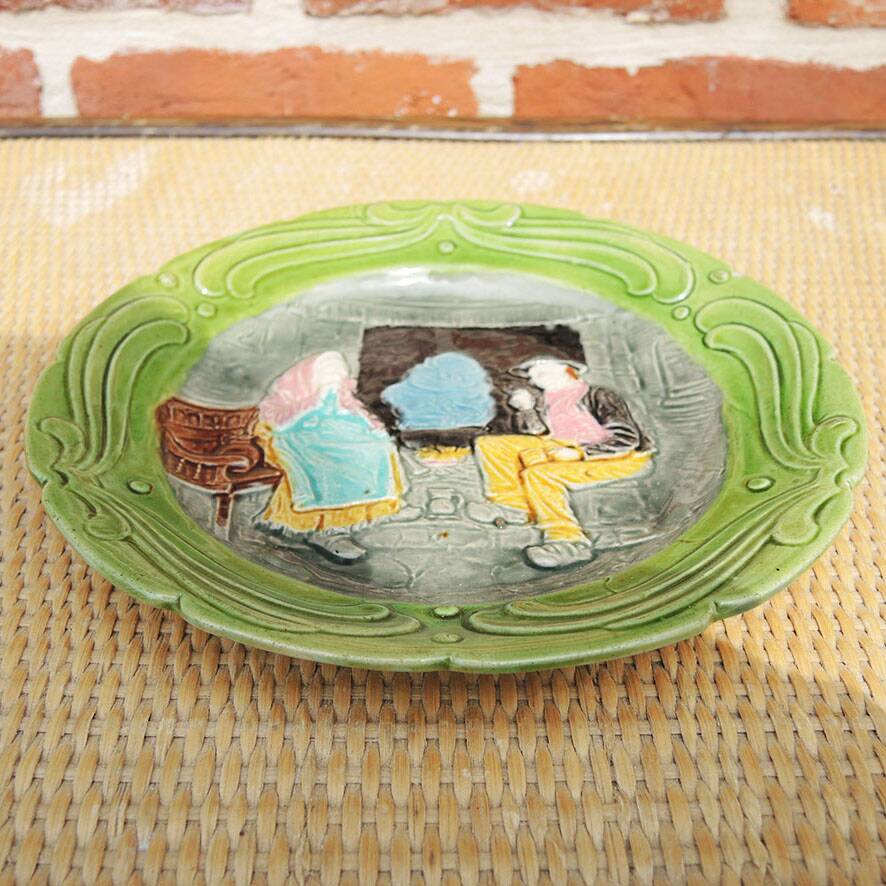Old slipware plate: couple of peasants