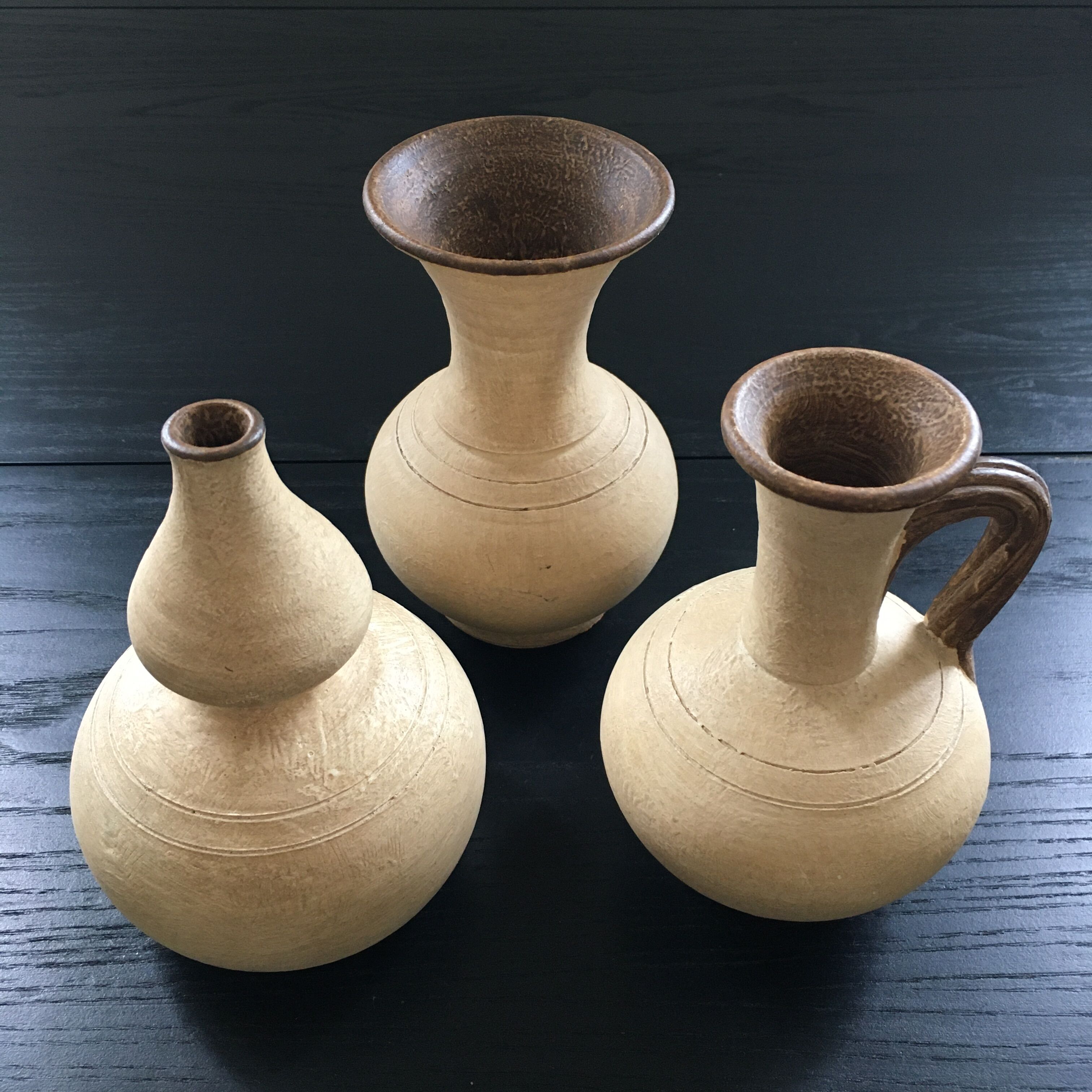 Trio of terracotta vases