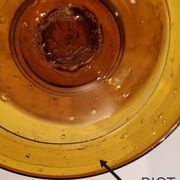 Bougeoir photophore Biot en verre ambré soufflé, bullé