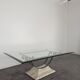 1980s coffee table with a travertine style and glass top.