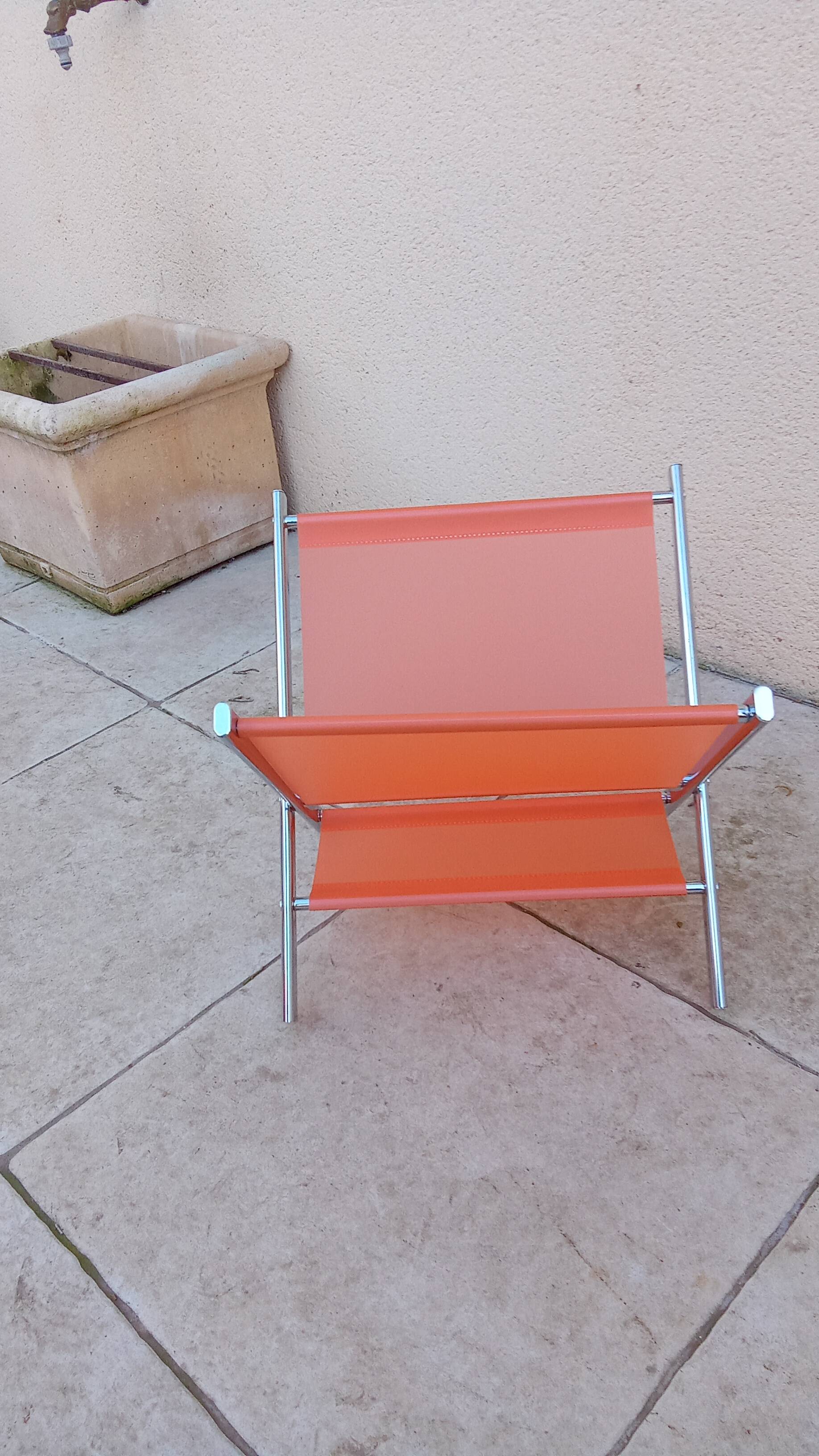 Vintage chrome and orange magazine rack from the 70s and 80s