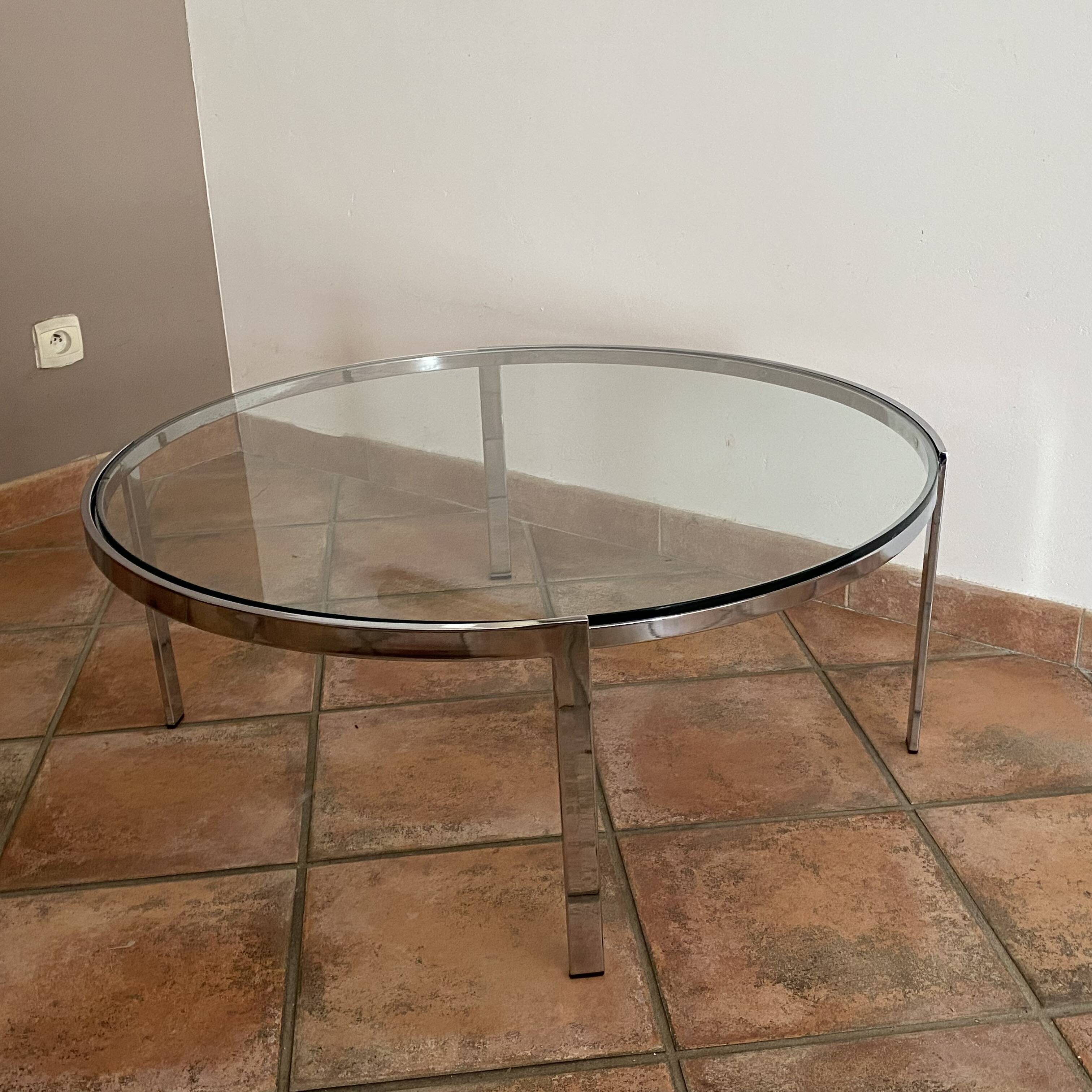 Space Age coffee table. 1970s. Chrome-plated steel and glass.