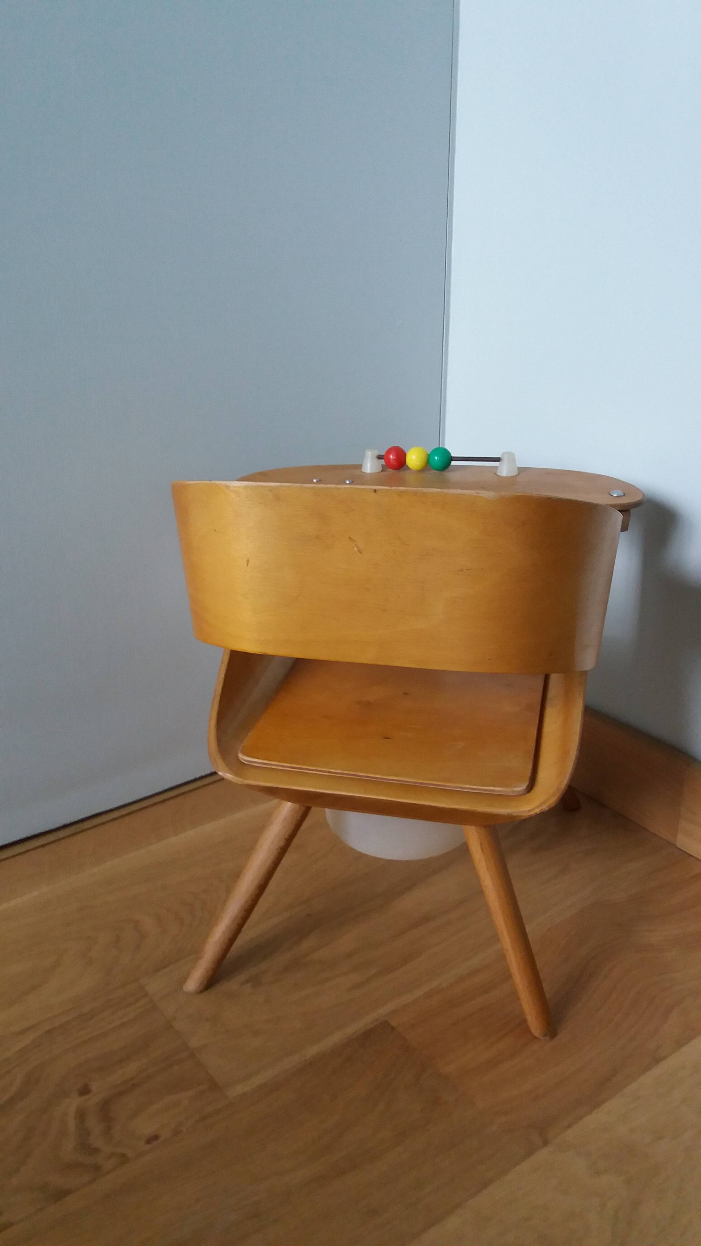 Baumann Baby Coquille children's armchair in bent wood with splayed legs.