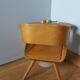 Baumann Baby Coquille children's armchair in bent wood with splayed legs.