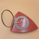 Triangular clock in red formica