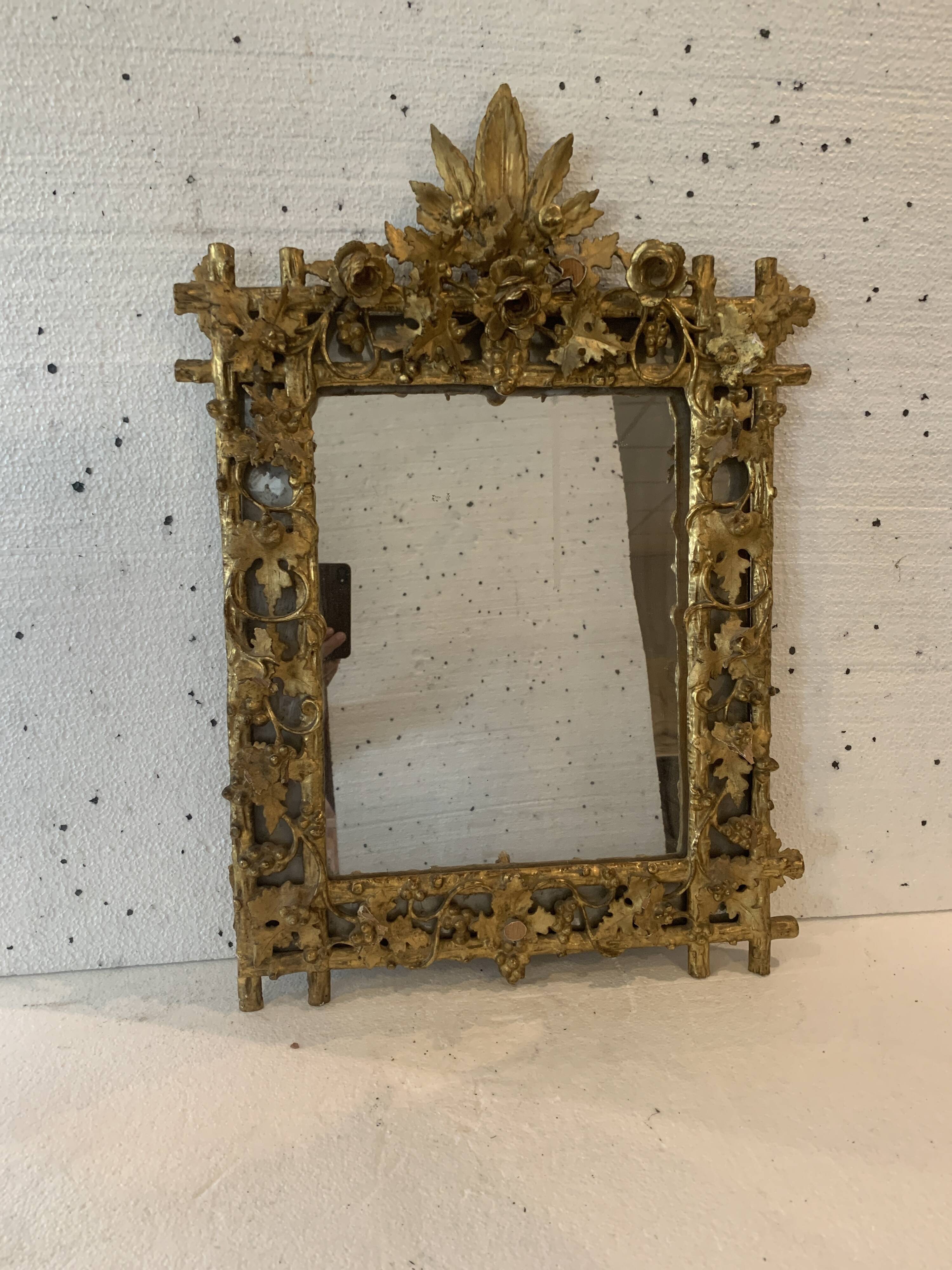 Louis XVI style mirror in carved wood and gilded with gold leaf, 19th century