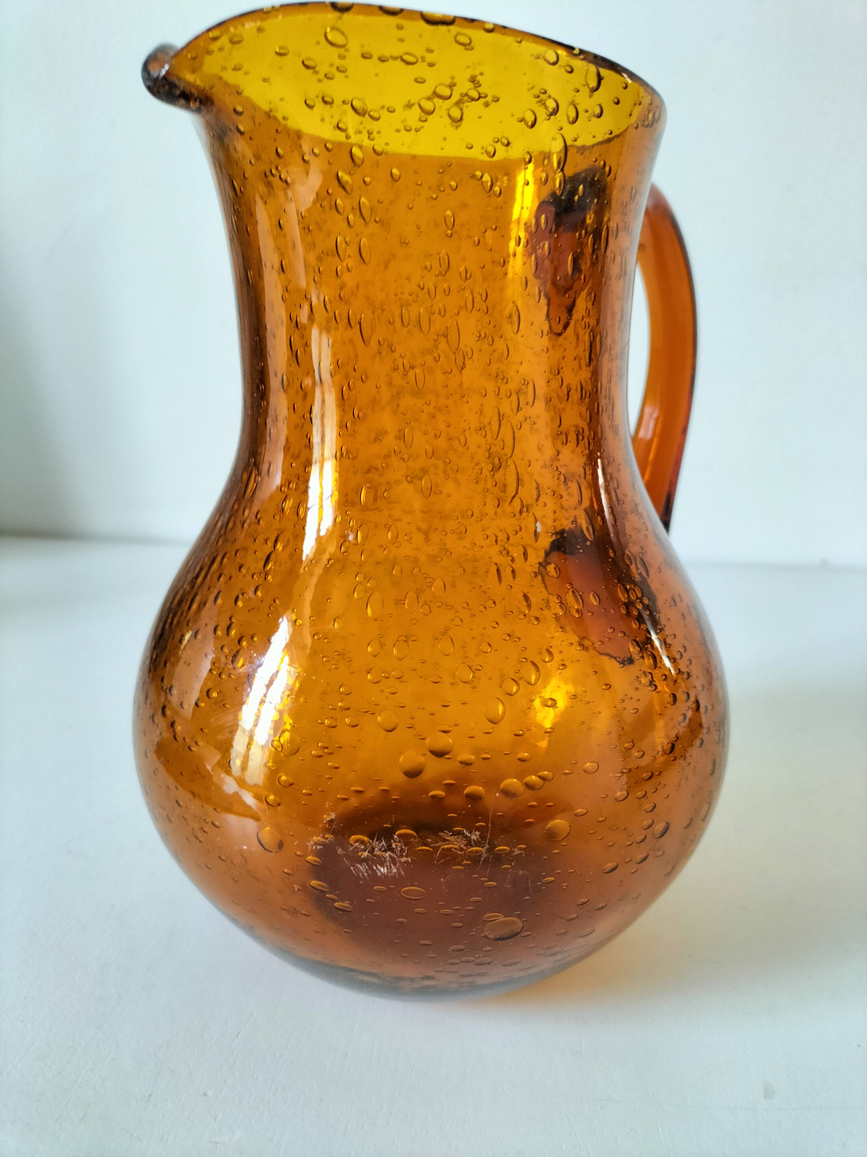 Blown glass pitcher with bubbles from Biot – amber colour