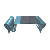 Design coffee table in tempered and curved glass with magazine holder