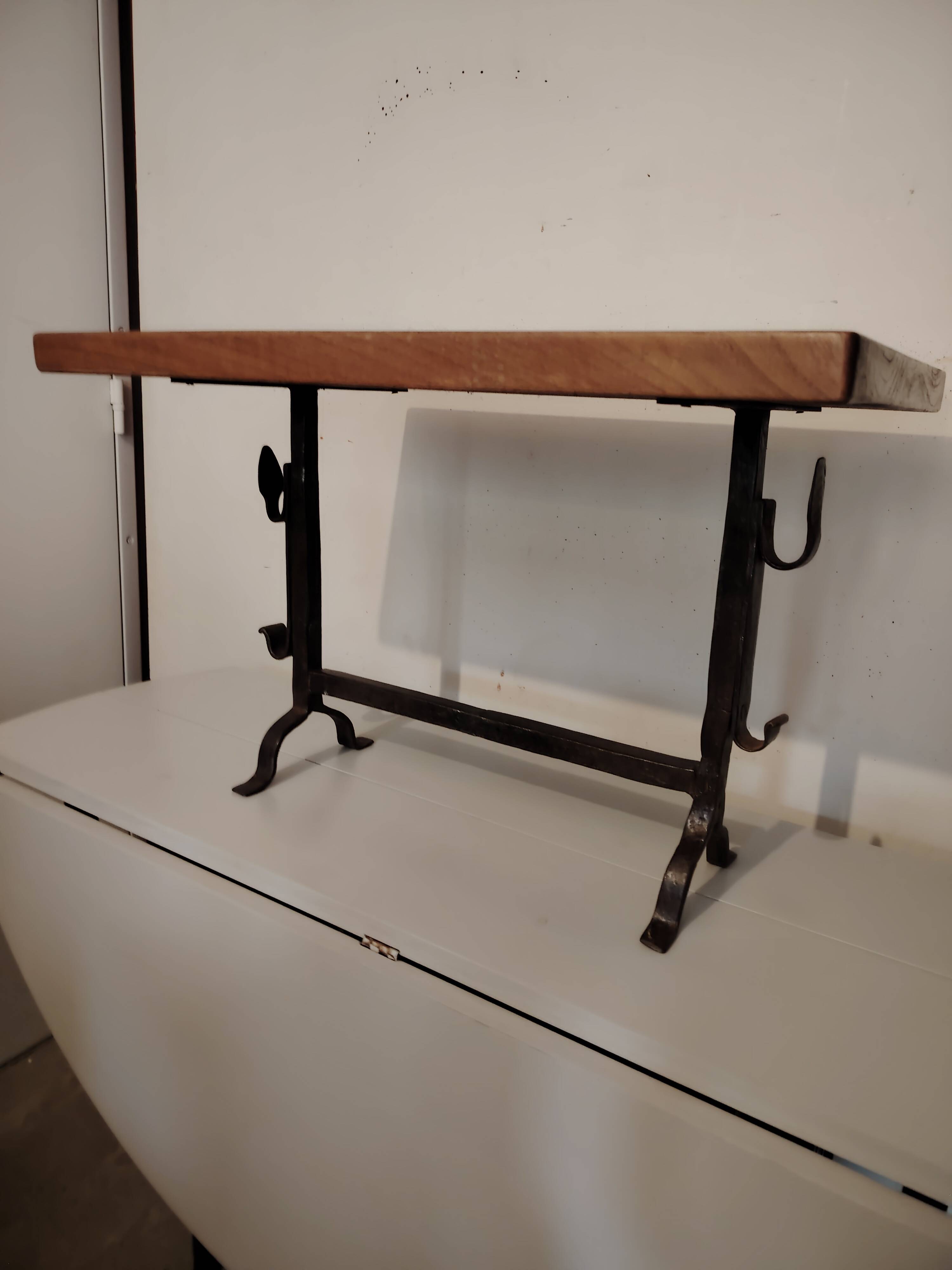 Solid wood and wrought iron coffee table