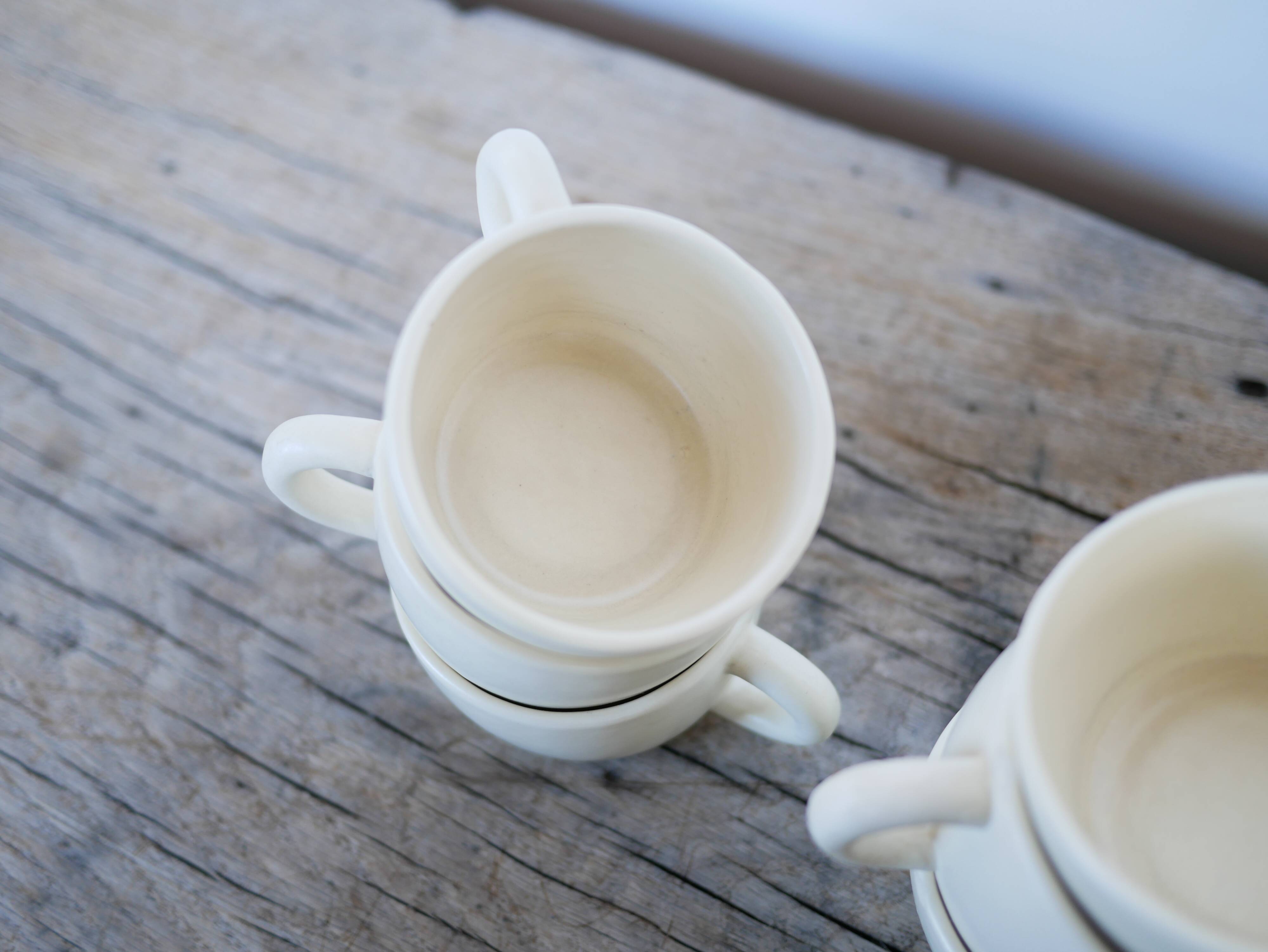 Series of 7 vintage ceramic cups and saucers by Le Pot de Terre