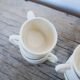 Series of 7 vintage ceramic cups and saucers by Le Pot de Terre