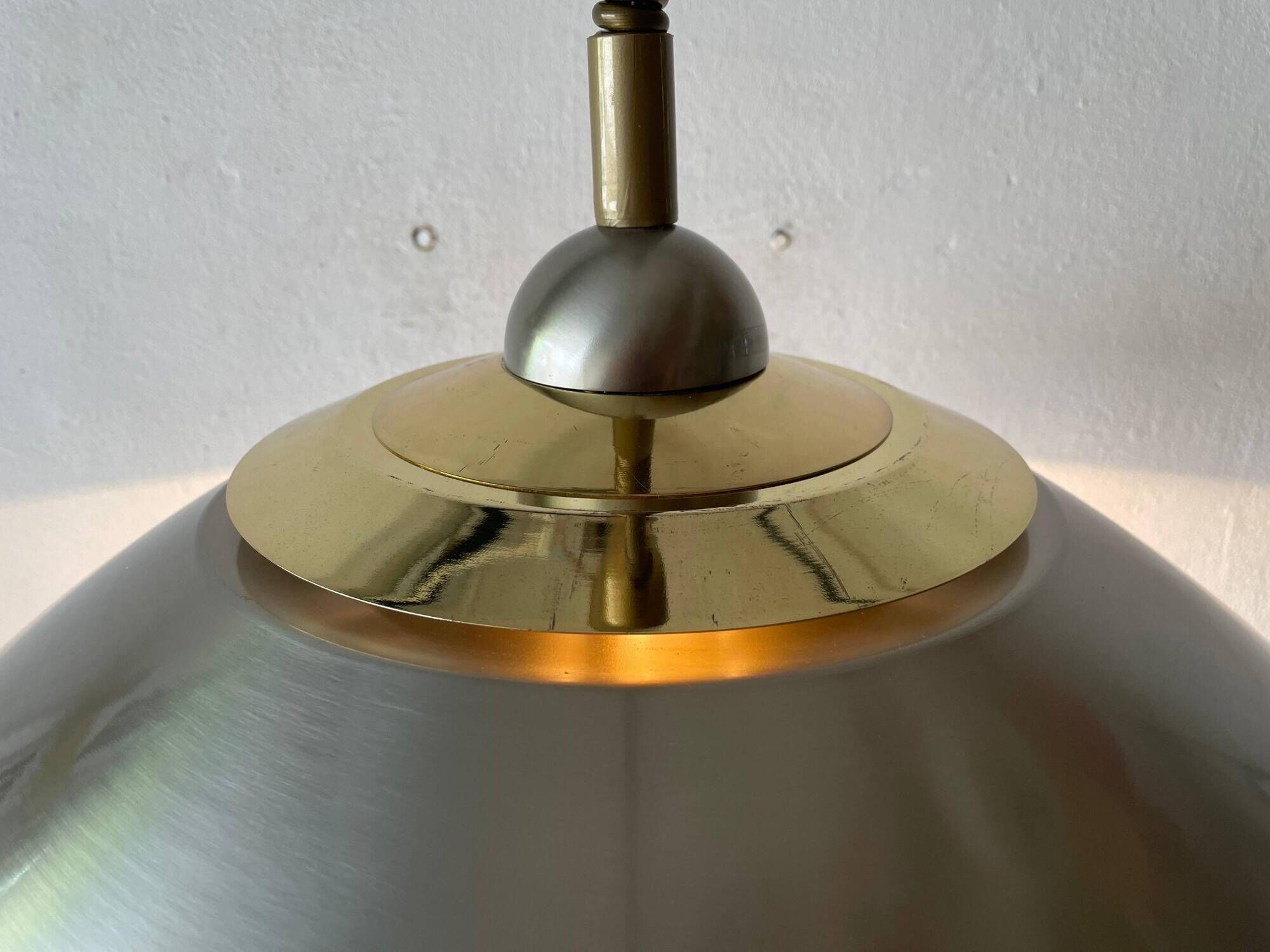 Suspended lamp in chrome and gold metal by TZ, 1970s, Germany.