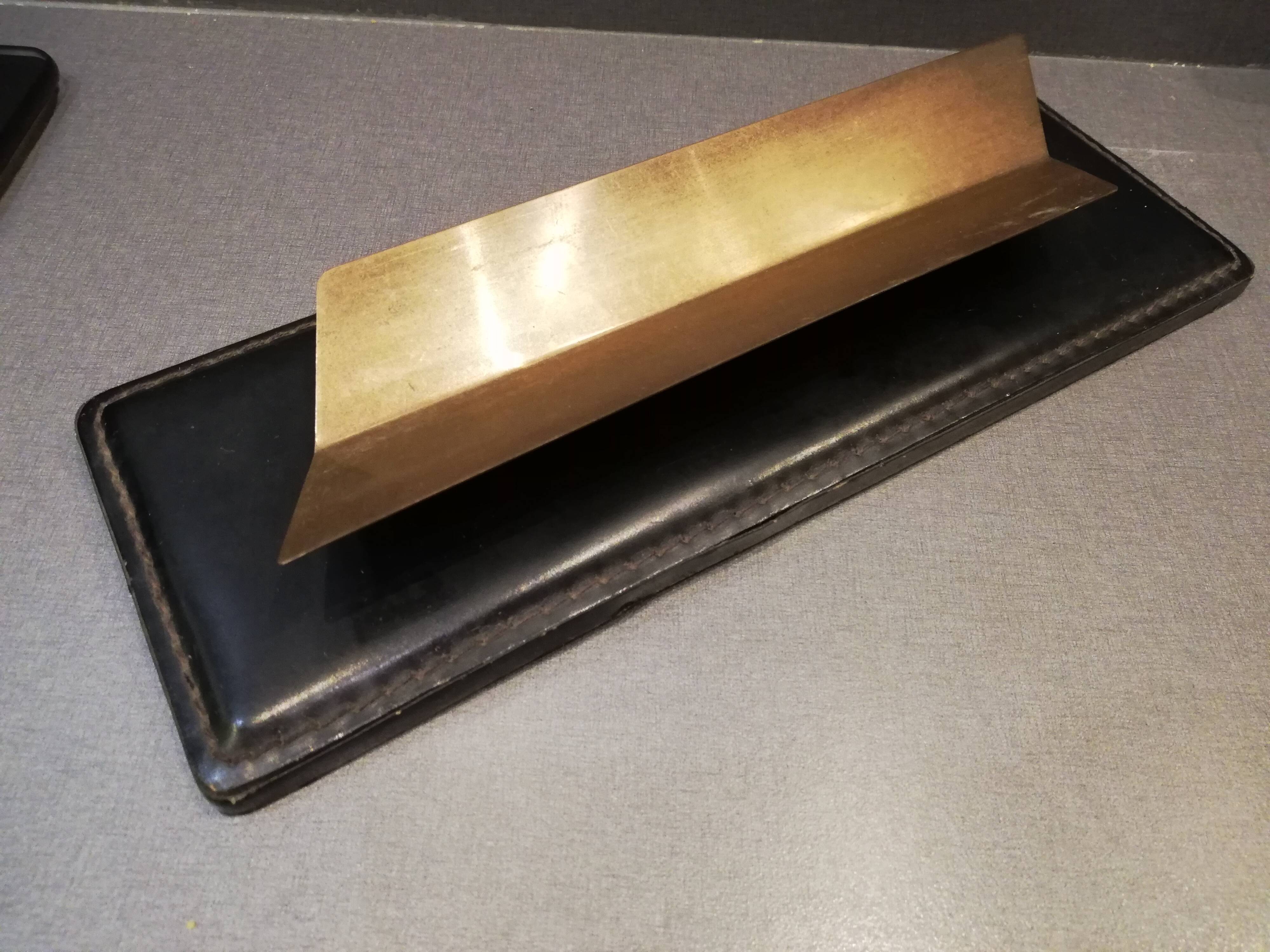 Set office stitched leather and brass wears feather pens