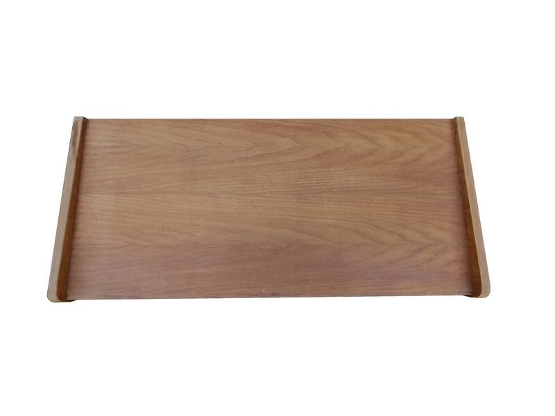 Renovated vintage commode from the 1960s in oak with slanted profile and tapered legs.