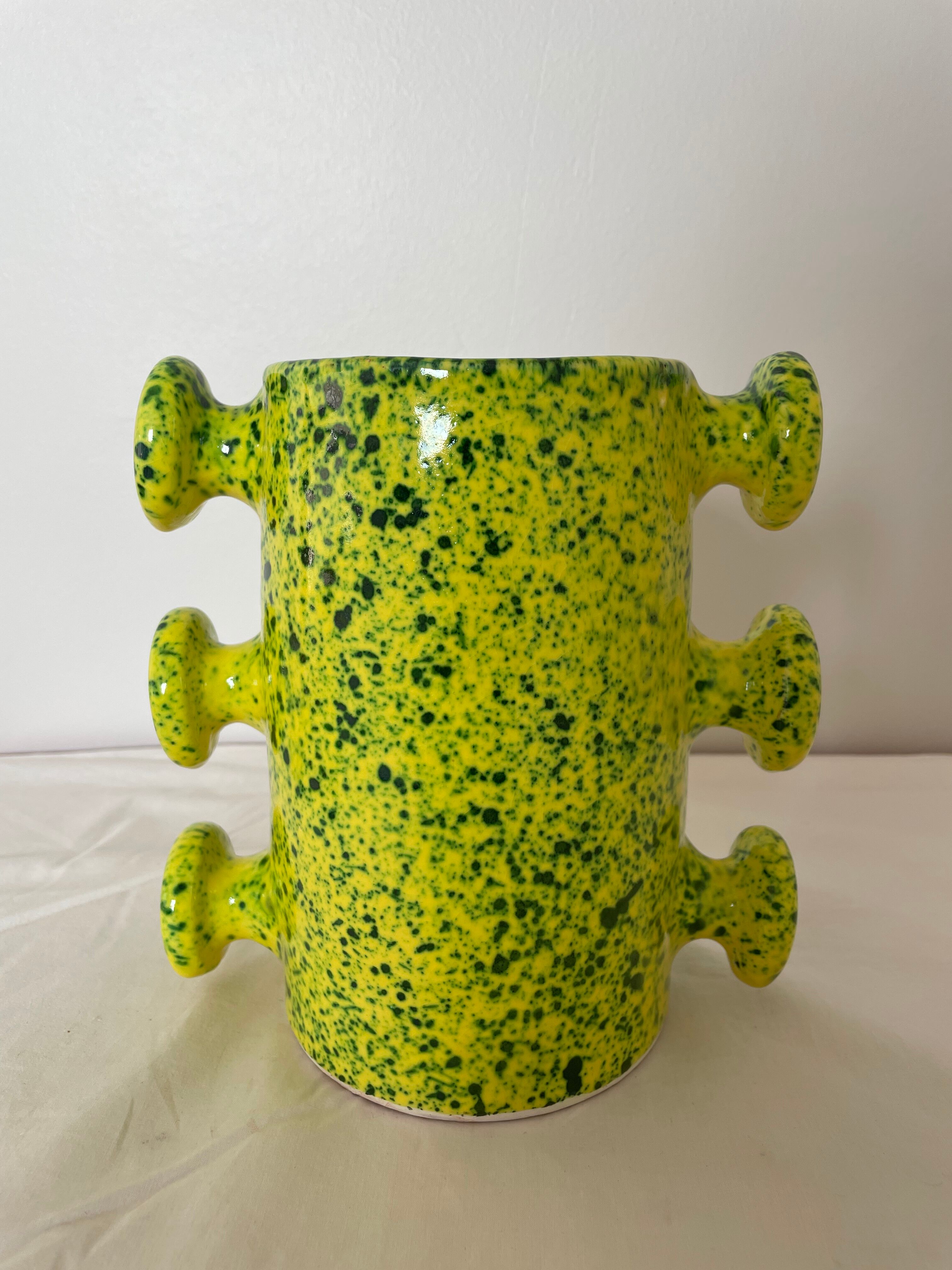 Handmade green speckled yellow ceramic vase with abstract handles