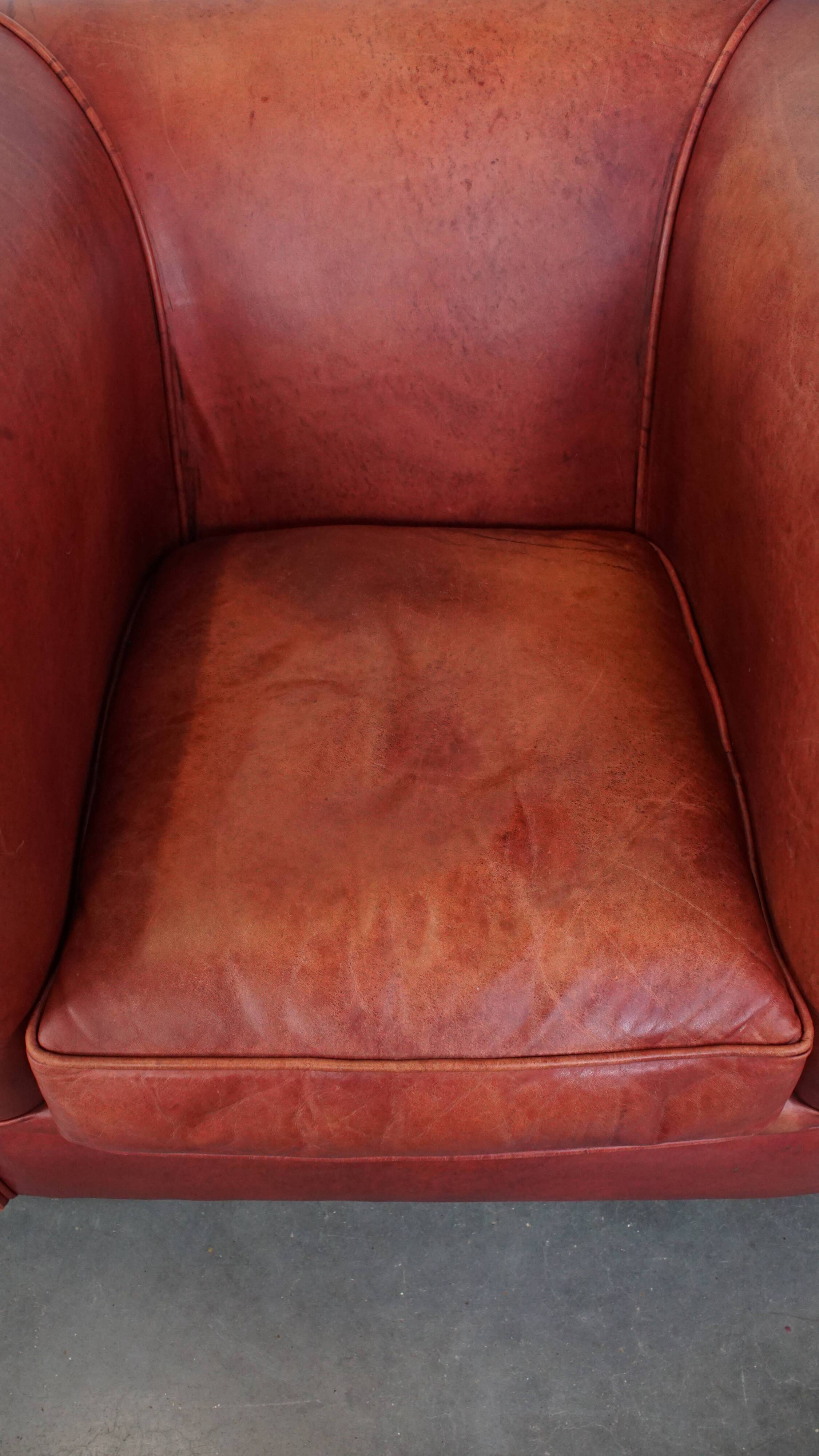 English Chesterfield club chair in light red cowhide leather