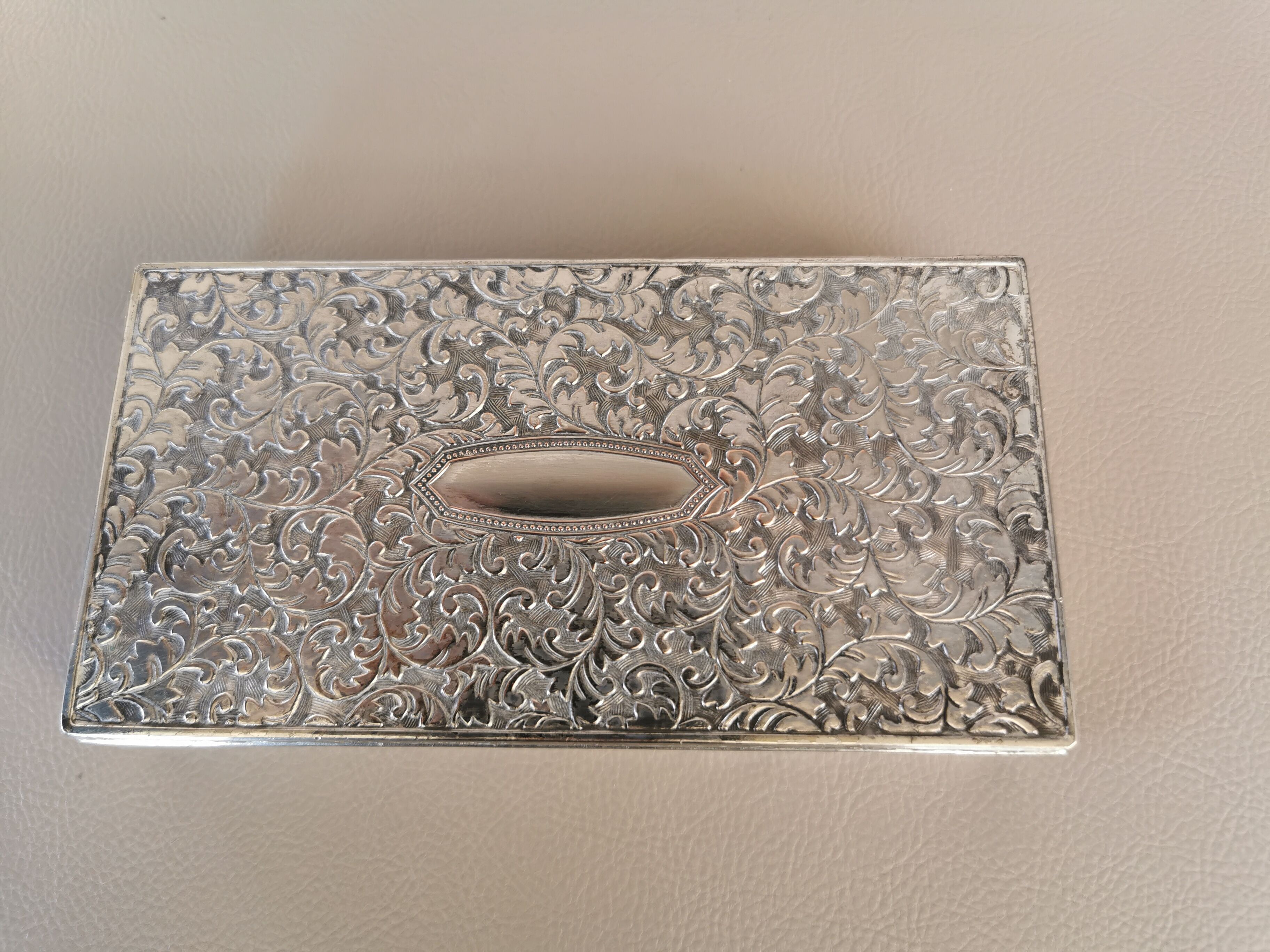 Old box in chiseled silver metal