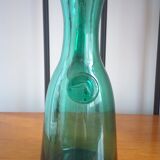 Pitcher made of green glass blown and tinted in the mass