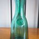 Pitcher made of green glass blown and tinted in the mass