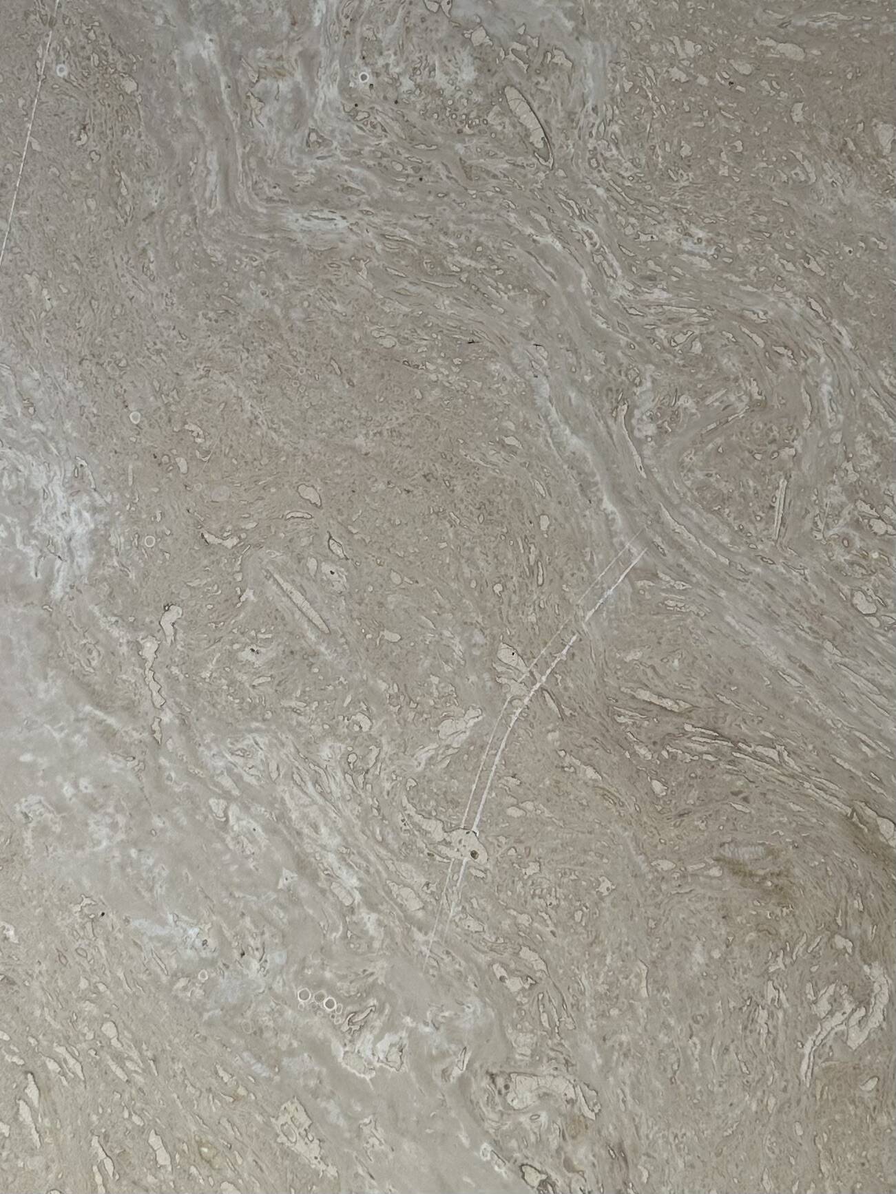 Travertine eye-shaped coffee table