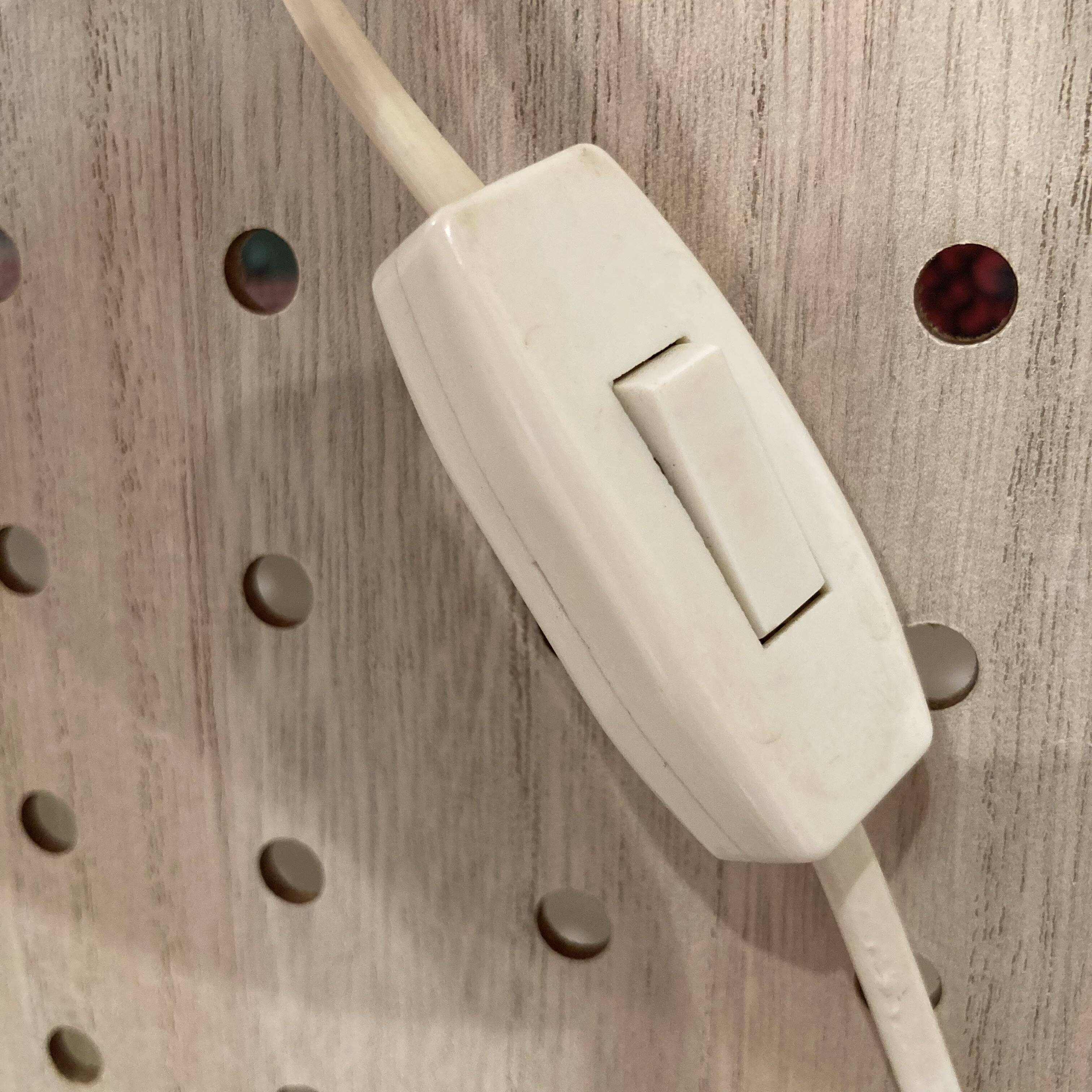 Scandinavian design wall light in teak and brass from the 1950s.