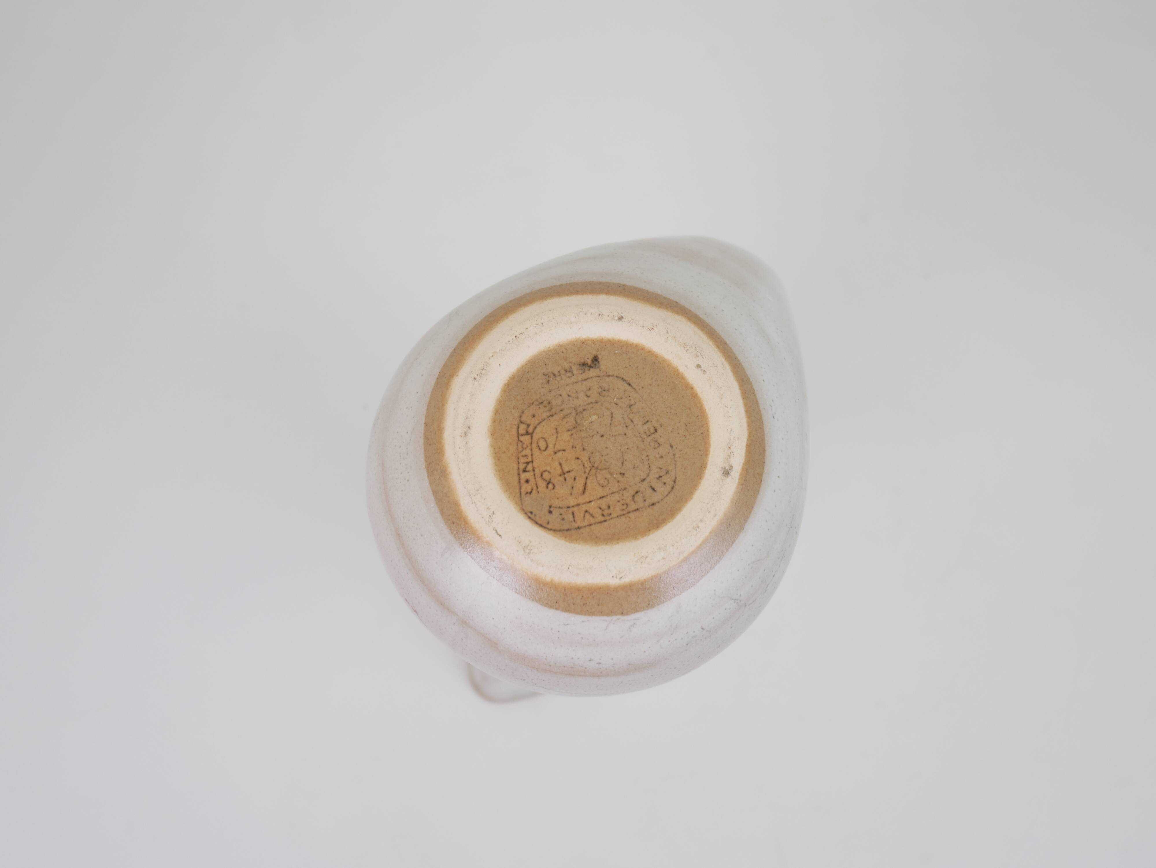 Signed white beige ceramic pitcher